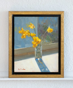 Daffodils in sunlight framed