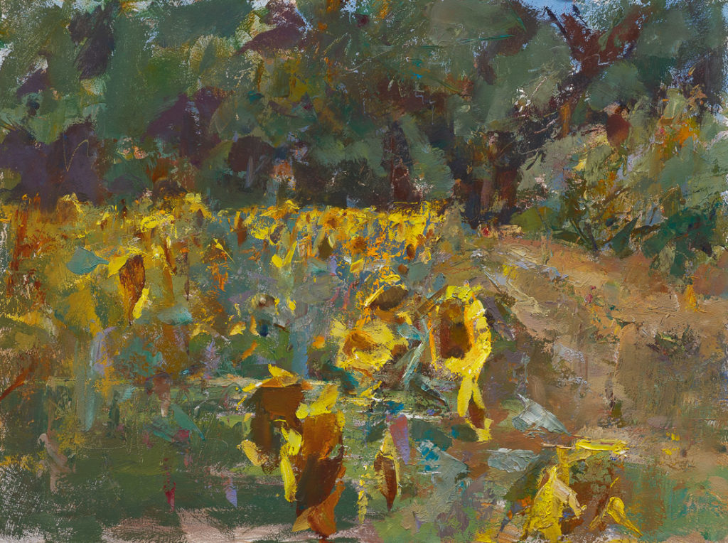 Sunflowers by the orchard